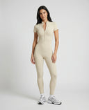 Ghost mannequin front view of yellow zip-front sculpting jumpsuit with short sleeves and full-length legs.
