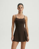 Women's brown padel dress with spaghetti straps and side splits displayed on ghost mannequin front view.