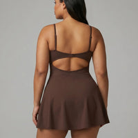 Women's brown padel dress with spaghetti straps and side splits displayed on ghost mannequin front view.
