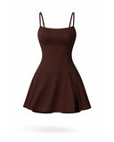 Women's brown padel dress with spaghetti straps and side splits displayed on ghost mannequin front view.
