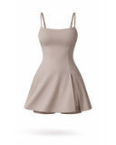Women's grey padel dress with thin straps and A-line skirt displayed on ghost mannequin, front view.
