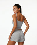 Ghost mannequin back view of gray sleeveless tank top showing clean back panel and strap placement.