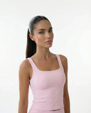 Ghost mannequin back view of pink sleeveless tank top showing clean back panel and strap detail.
