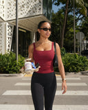 Plus size model back view wearing red sleeveless crop tank showing inclusive fit across shoulders and torso.