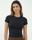 Ghost mannequin back view of the black fitted t-shirt top displaying smooth seam construction and tapered hem.