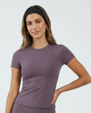 Ghost mannequin front view of purple fitted short sleeve t-shirt top showing crew neckline and sculpting fit.