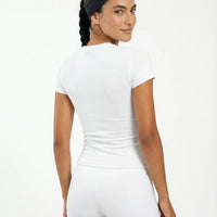 Ghost mannequin back view of white ribbed t-shirt top displaying clean seam finish and fitted silhouette.