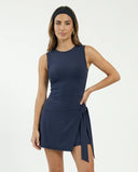 Women's blue active dress with wrap skirt detail displayed on ghost mannequin, front view showing crew neckline and tie waist.