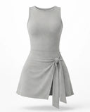 Women's grey active set with sculpting sleeveless top and wrap-tie skirt displayed on ghost mannequin, front view.
