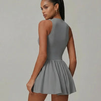 Back view of SEEN Essential grey padel dress on ghost mannequin highlighting sleeveless design and skirt silhouette.